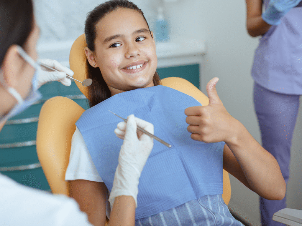 kid smiling in dentist